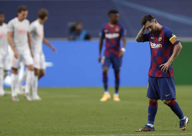 Lionel Messi hangs his head in anguish during Barcelona’s 8-2 destruction by Bayern Munich. Picture: AP.