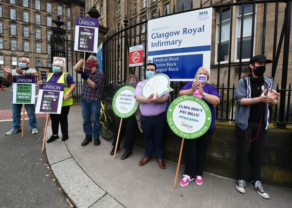 NHS nurses protest outside Glasgow Royal Infirmary after being left out of a public sector pay rise (Picture: John Devlin)