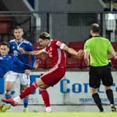 Ryan Hedge had only just been introduced as a substitute  when he fired this shot into the St Johnstone net, with the aid of a deflection, to clinch a 1-0 victory for the Dons. Picture: SNS.
