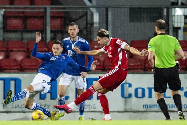 Ryan Hedge had only just been introduced as a substitute  when he fired this shot into the St Johnstone net, with the aid of a deflection, to clinch a 1-0 victory for the Dons. Picture: SNS.