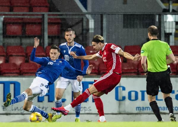 Ryan Hedge had only just been introduced as a substitute  when he fired this shot into the St Johnstone net, with the aid of a deflection, to clinch a 1-0 victory for the Dons. Picture: SNS.