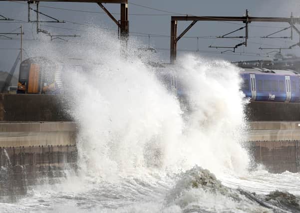 A train passes in Saltcoats on the west coast of North Ayrshire as gusts of up to 70mph could hit coastal areas as Storm Ellen moves on and leaves more wet and windy weather in its wake.