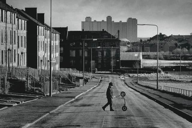 Douglas Stuart, main, revisits the Glasgow of his childhood in the 1980 and 1990s in his novel. 
A boy plays with a scooter in Killearn Street, Possil, Glasgow, 1995. Picture: Robert Perry
