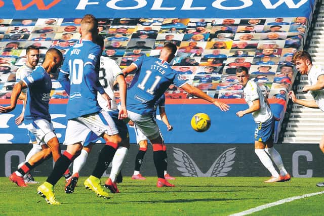 New recruit Kemar Roofe, left, converts a Borna Barisic cross to put Rangers ahead at Ibrox. Photograph: Rob Casey/SNS