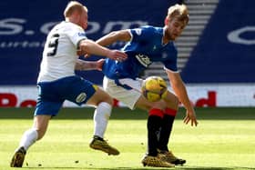 Filip Helander tries to hold off the attentions of Chris Burke during Rangers' comfortable win against Kilmarnock. Picture: Jane Barlow/PA