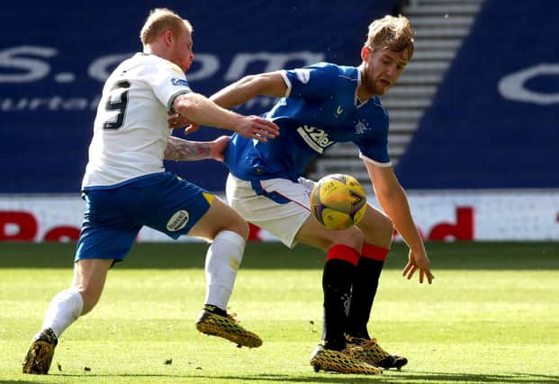 Filip Helander tries to hold off the attentions of Chris Burke during Rangers' comfortable win against Kilmarnock. Picture: Jane Barlow/PA