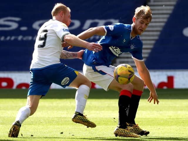 Filip Helander tries to hold off the attentions of Chris Burke during Rangers' comfortable win against Kilmarnock. Picture: Jane Barlow/PA