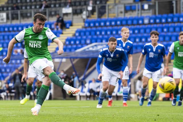 Hibs substitute Stevie Mallan sweeps home his late penalty. Picture: Bill Murray/SNS