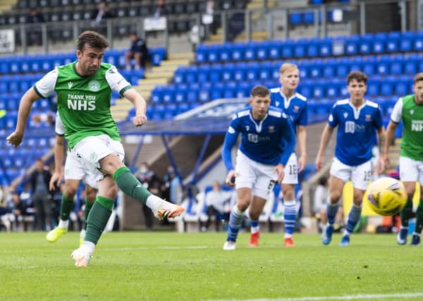 Hibs substitute Stevie Mallan sweeps home his late penalty. Picture: Bill Murray/SNS