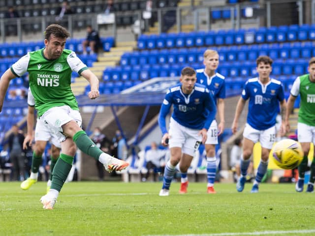 Hibs substitute Stevie Mallan sweeps home his late penalty. Picture: Bill Murray/SNS