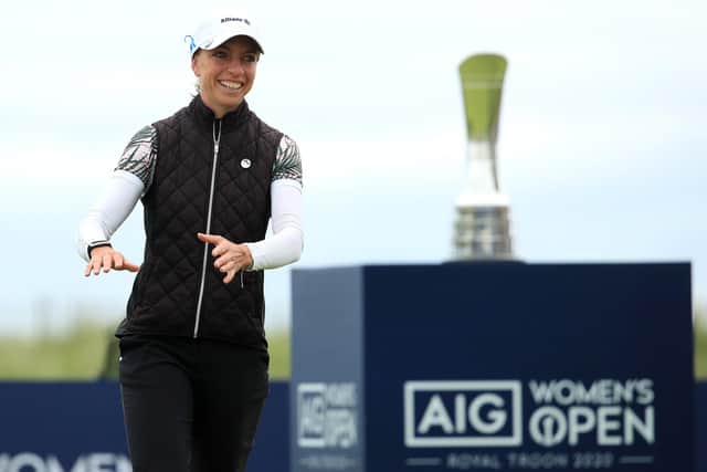Sophia Popov walks forward to collect her trophy following her two-shot victory in the AIG Women’s Open. Picture: R&A via Getty.
