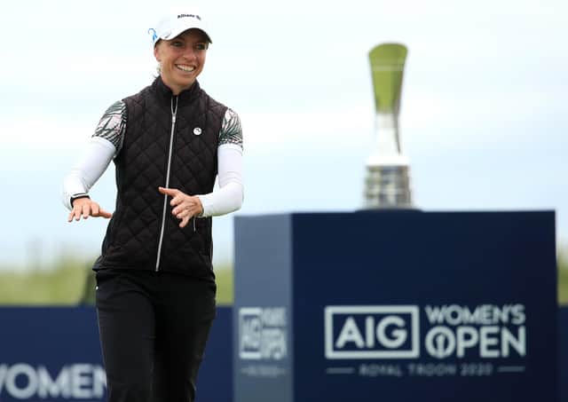 Sophia Popov walks forward to collect her trophy following her two-shot victory in the AIG Women’s Open. Picture: R&A via Getty.