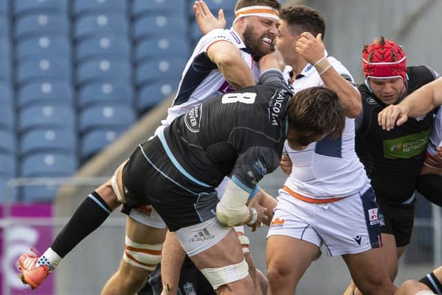 Edinburgh's Nick Haining gets up close and personal with Glasgow Warriors' Ryan Wilson during Saturday's match at BT Murrayfield. Picture: Ross Parker / SNS