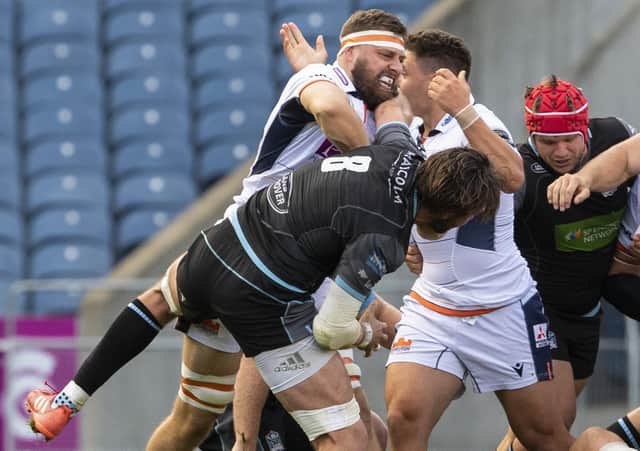 Edinburgh's Nick Haining gets up close and personal with Glasgow Warriors' Ryan Wilson during Saturday's match at BT Murrayfield. Picture: Ross Parker / SNS