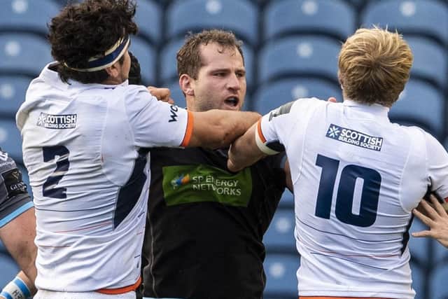 Glasgow captain Fraser Brown, centre, clashes with Edinburgh's Stuart McInally, left, and Jaco van der Walt. Picture: Ross Parker/SNS