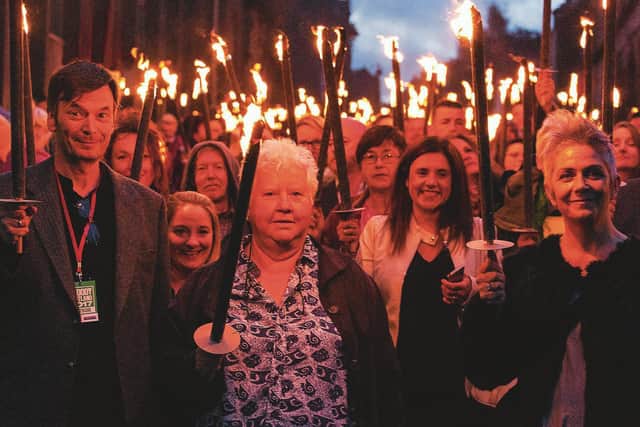 Val McDermid, with Ian Rankin and Denise Mina, at the head of the torchlight procession at Bloody Scotland in Stirling in 2017
