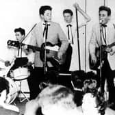 A 15-year-old Paul McCartney, left, with John Lennon, centre, makes his debut with the Quarrymen in 1957. Just a year later, he wrote When I’m Sixty-Four (Picture: PA)