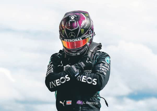 Lewis Hamilton perform the Wakanda Salute in tribute to Chadwick Boseman. Picture: AFP via Getty Images