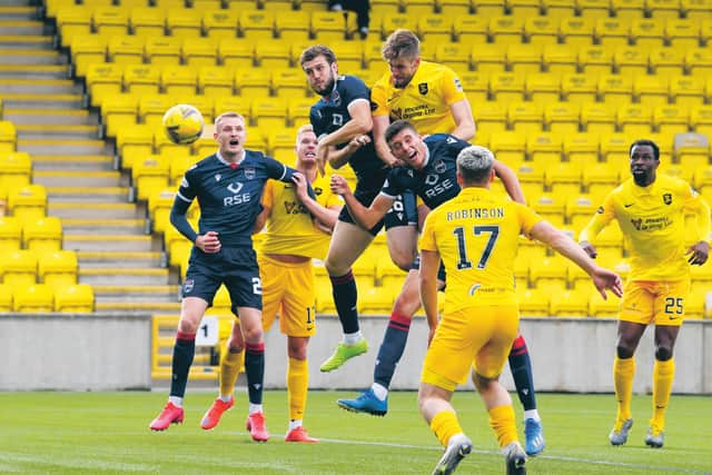 Flashpoint: Livingston’s Jon Guthrie gets above Ross Stewart to nod home the winner, the incident that sparked fury from County boss Stuart Kettlewell, earning him a red card. Photograph: Rob Casey: SNS
