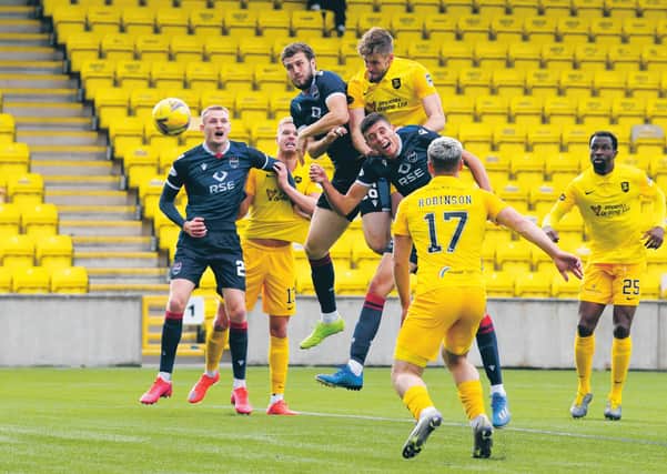 Flashpoint: Livingston’s Jon Guthrie gets above Ross Stewart to nod home the winner, the incident that sparked fury from County boss Stuart Kettlewell, earning him a red card. Photograph: Rob Casey: SNS
