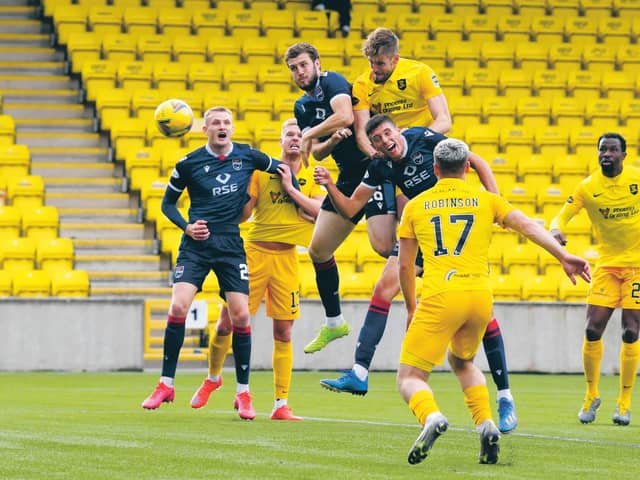 Flashpoint: Livingston’s Jon Guthrie gets above Ross Stewart to nod home the winner, the incident that sparked fury from County boss Stuart Kettlewell, earning him a red card. Photograph: Rob Casey: SNS