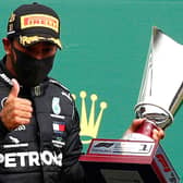 Mercedes' British driver Lewis Hamilton gestures on the podium after winning the Belgian Formula One Grand Prix at the Spa-Francorchamps circuit. Picture: AFP via Getty Images