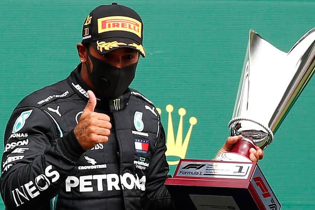 Mercedes' British driver Lewis Hamilton gestures on the podium after winning the Belgian Formula One Grand Prix at the Spa-Francorchamps circuit. Picture: AFP via Getty Images