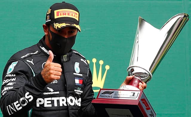 Mercedes' British driver Lewis Hamilton gestures on the podium after winning the Belgian Formula One Grand Prix at the Spa-Francorchamps circuit. Picture: AFP via Getty Images