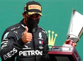 Mercedes' British driver Lewis Hamilton gestures on the podium after winning the Belgian Formula One Grand Prix at the Spa-Francorchamps circuit. Picture: AFP via Getty Images