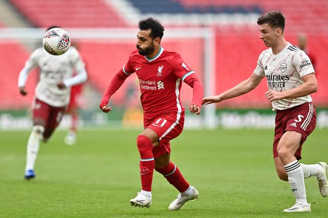 Kieran Tierney, right, vies with Liverpool's Mohamed Salah during Saturday's Community Shield showdown. Picture: Justin Tallis/pool via Getty Images