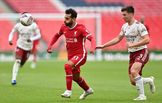 Kieran Tierney, right, vies with Liverpool's Mohamed Salah during Saturday's Community Shield showdown. Picture: Justin Tallis/pool via Getty Images