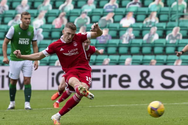 Lewis Ferguson coolly converts his first-half penalty to give Aberdeen victory at Easter Road. Picture: Ross Parker/SNS