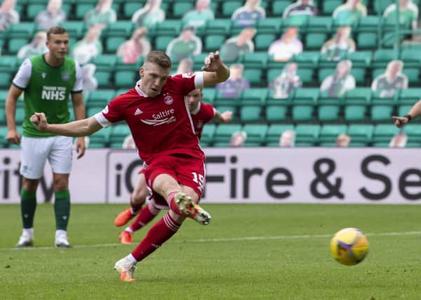 Lewis Ferguson coolly converts his first-half penalty to give Aberdeen victory at Easter Road. Picture: Ross Parker/SNS