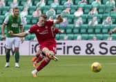 Lewis Ferguson coolly converts his first-half penalty to give Aberdeen victory at Easter Road. Picture: Ross Parker/SNS