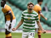 James Forrest celebrates scoring Celtic's opening goal against Motherwell. Picture: PA.