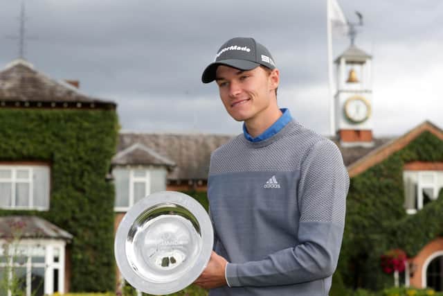 Rasmus Hojgaard shows off his trophy following his victory in the ISPS Handa UK Championship at The Belfry yesterday. Picture: PA.
