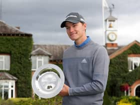 Rasmus Hojgaard shows off his trophy following his victory in the ISPS Handa UK Championship at The Belfry yesterday. Picture: PA.