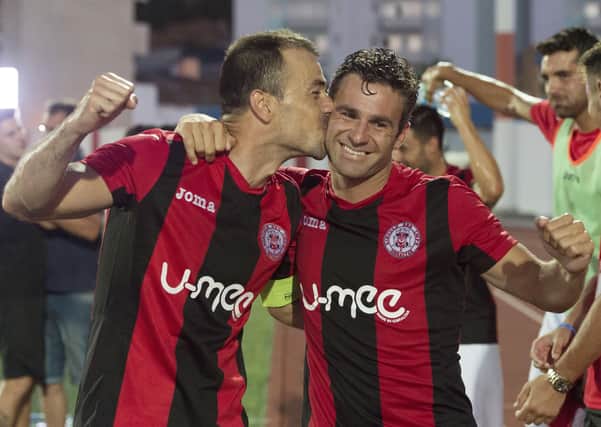 Roy Chipolina plants a kiss on Lee Casciaro after the veteran’s goal back in 2016 gave Lincoln Red Imps a famous 1-0 victory over Celtic. Picture: Craig Foy/SNS
