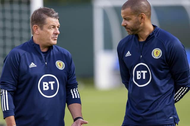 John Carver, left, with fellow coach Steven Reid at Scotland training