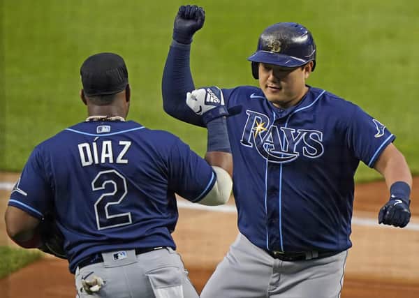 Tampa Bay Rays’ Ji-Man Choi, right, celebrates after hitting a two-run home run during his team’s 5-3 victory over the New York Yankees on Monday. Picture: AP.