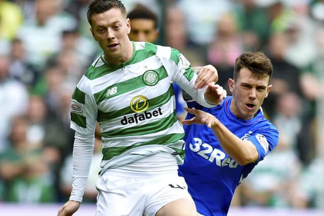 Celtic's Callum McGregor holds off Rangers' Ryan Jack in an  Old Firm clash