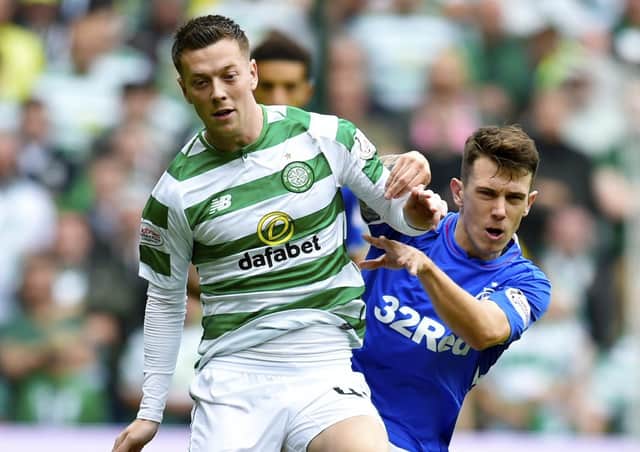 Celtic's Callum McGregor holds off Rangers' Ryan Jack in an Old Firm clash