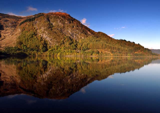 An autumnal light bathes the hills overlooking Loch Earn (Picture: Donald MacLeod)