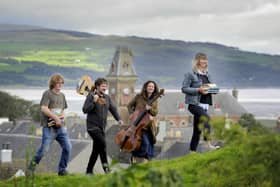 (Left to right) Shaun Bythell, Ben Porter, Beth Porter and Jane Baldwin, at Wigtown's Martyr's Stake in Wigtown Bay. They will all be launching Wigtown Book Festival. Picture: Colin Hattersley/Wigtown Book Festival Company/PA Wire