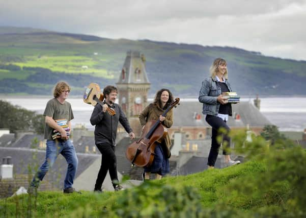 (Left to right) Shaun Bythell, Ben Porter, Beth Porter and Jane Baldwin, at Wigtown's Martyr's Stake in Wigtown Bay. They will all be launching Wigtown Book Festival. Picture: Colin Hattersley/Wigtown Book Festival Company/PA Wire