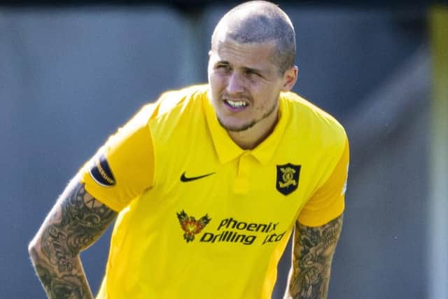 Livingston striker Lyndon Dykes in action against Hibernian in August