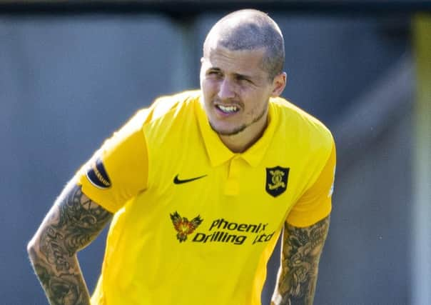 Livingston striker Lyndon Dykes in action against Hibernian in August