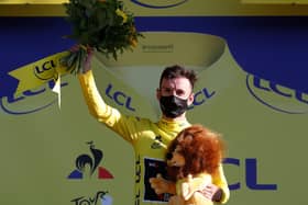 Adam Yates on the podium. Picture: Thibauld Camus/AFP