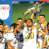 As captain of Leeds United, Liam Cooper lifts the Championship trophy. Picture: Michael Regan/Getty Images