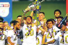 As captain of Leeds United, Liam Cooper lifts the Championship trophy. Picture: Michael Regan/Getty Images